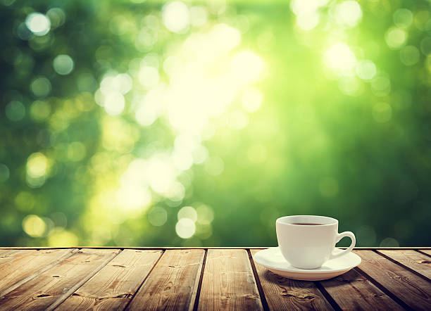 Cup Coffee And Sunny Trees Background Stock Photo - Download Image Now -  Coffee - Drink, Cafe, Coffee Cup - iStock
