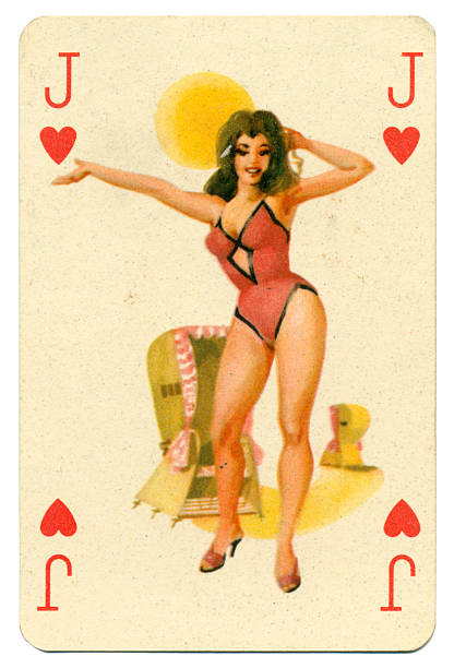 Seaside pin-up Romikartya 4 vintage playing card Hungary 1950s This Jack of Hearts pin-up playing card was manufactured in the 1950s by Játékkártyagyár és Nyomda (the National Playing Card Factory and Printing Company) of Budapest in Hungary. It shows a bathing beauty / pin-up from the pack known as Romikartya 4, which features 1950s pin-up girls, bathing beauties with seaside backgrounds. Dressed in a one-piece bathing costume, the pin-up model stands before covered beach chairs in a 1950s style. The company traded from 1950-1974. Following the Second World War, from 1946-1949, the Austrian-owned company Piatnik continued to operate the factory under licence. In 1950 it became the National Playing Card Factory and Printing Company, incorporating several firms such as the factory in Rottenbiller street; Albert Bakács & Son Printing House, and Emil Seidner posters and label printing press. pin up girl photos stock pictures, royalty-free photos & images
