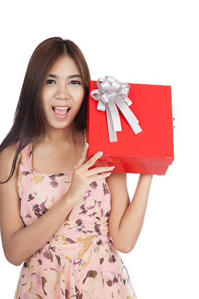 istock Beautiful Asian woman with red gift box 517079245