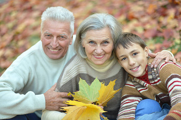 istock Family in autumn park 517081204