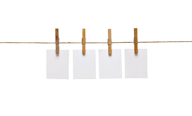istock clothes peg and note paper on clothes line rope 517082652