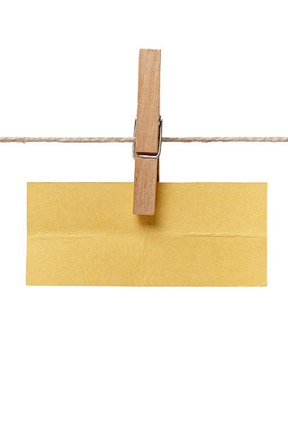 istock clothes peg and note paper on clothes line rope 517082890