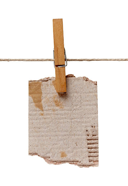 istock clothes peg and note paper on clothes line rope 517083188