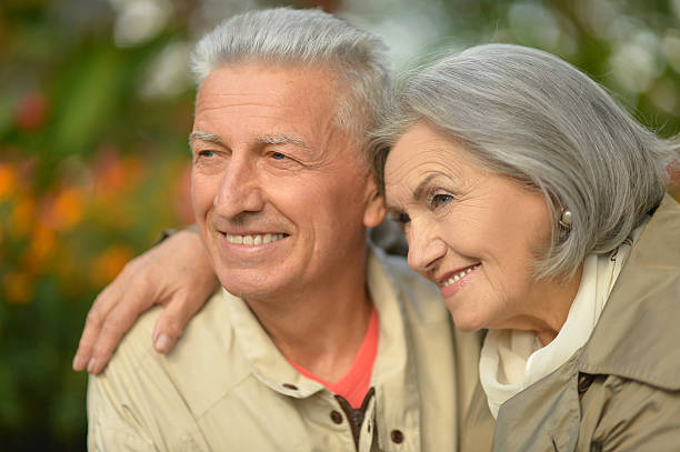 istock Senior couple in autumn park 517083274