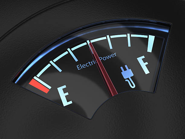 istock Electric fuel gauge with the needle indicating a middle battery 517084238