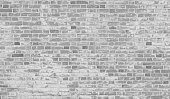 Grey white old brick wall.