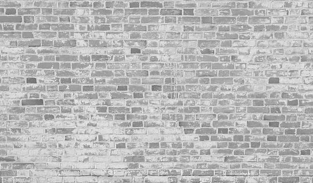 Grey white old brick wall. stock photo