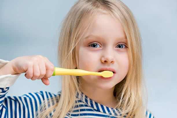 Brushing teeth Cute girl brushing teeth brushing teeth stock pictures, royalty-free photos & images