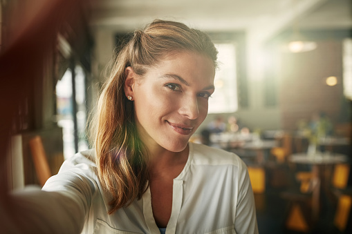 Shot of an attractive young woman in a coffee shop