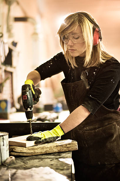 istock Woman working with electric drill 517086508