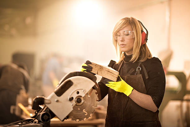 istock Woman working with circular saw 517086838