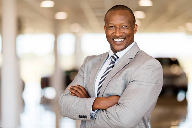 istock african car sales consultant with arms folded 517087756