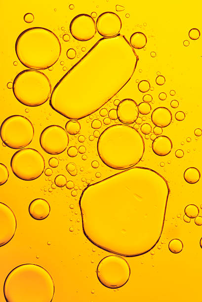 istock Oil and Water - Abstract Background Yellow Macro 517089478