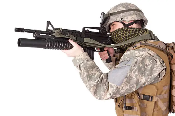 US soldier with assault rifle on white background
