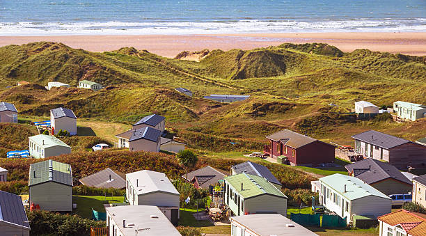British Holiday Lodges or Huts in the Morning A photo of British holiday lodges / cabins / huts in the morning, located in typical British and Welsh camping sites by the sea. rhossili bay stock pictures, royalty-free photos & images
