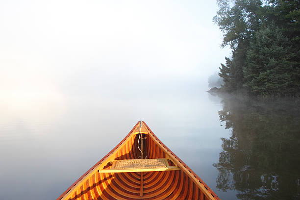 istock Canoeing on a Misty Lake 517093127