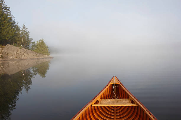 istock Canoeing on a Misty Lake 517093201