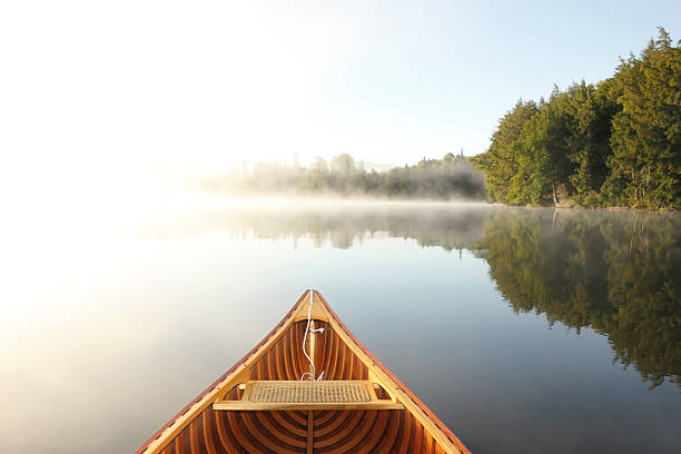 istock Canoeing on a Misty Lake 517093229