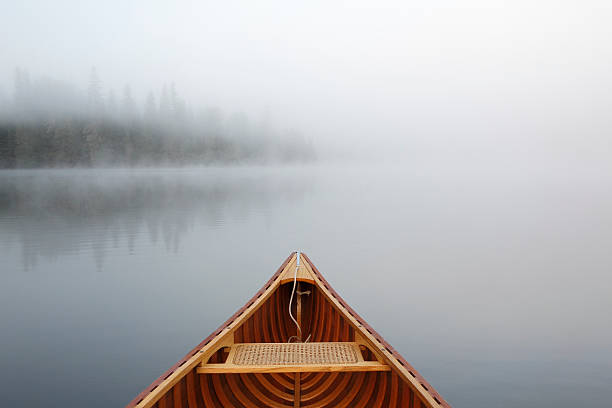 istock Canoeing on a Misty Lake 517093273