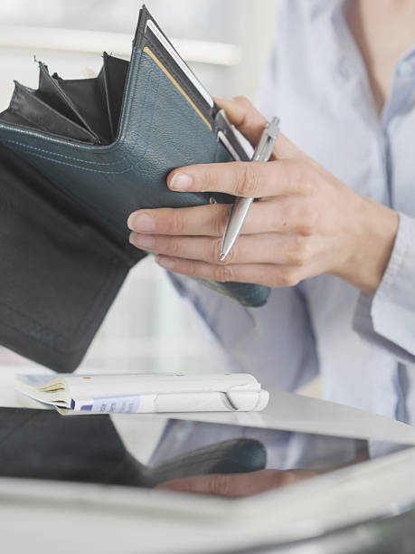 istock woman hands purse 517093933