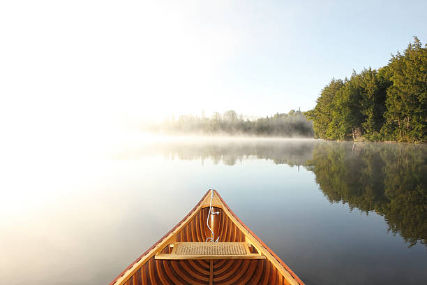 istock Canoeing on a Misty Lake 517095069