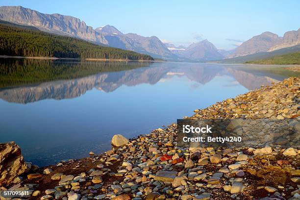 Water Reflections Along A Clear Lake In Glacier National Park Stock Photo - Download Image Now