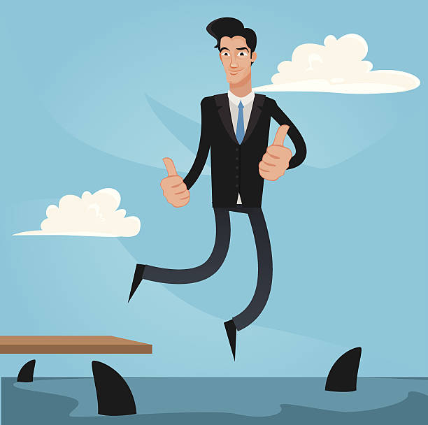 istock businessman jumping in to a sharks pool 517096165