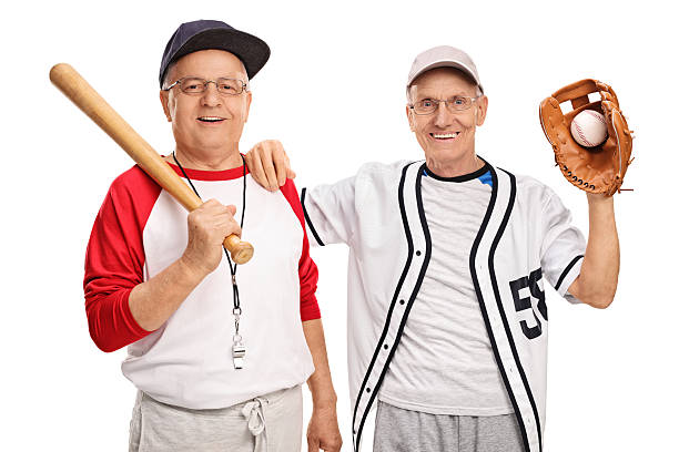 два пожилых субъектов с длинными рукавами - baseball player baseball holding bat стоковые фото и изображения