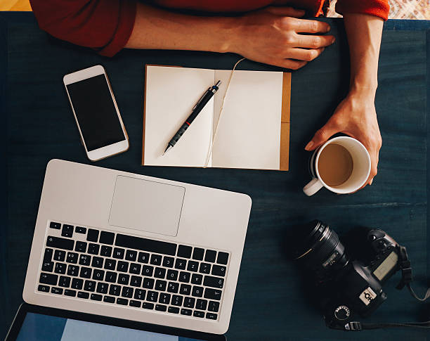 istock Overhead image of a workspace on the desk 517105958