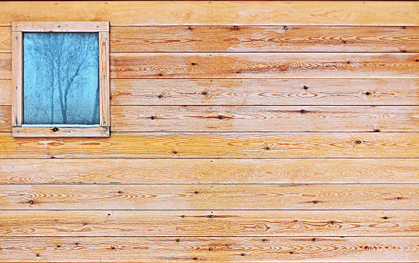 istock Wooden wall with a small window 517105966
