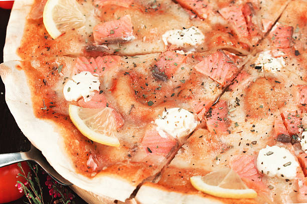 istock Tasty pizza with fish and cheese 517106068