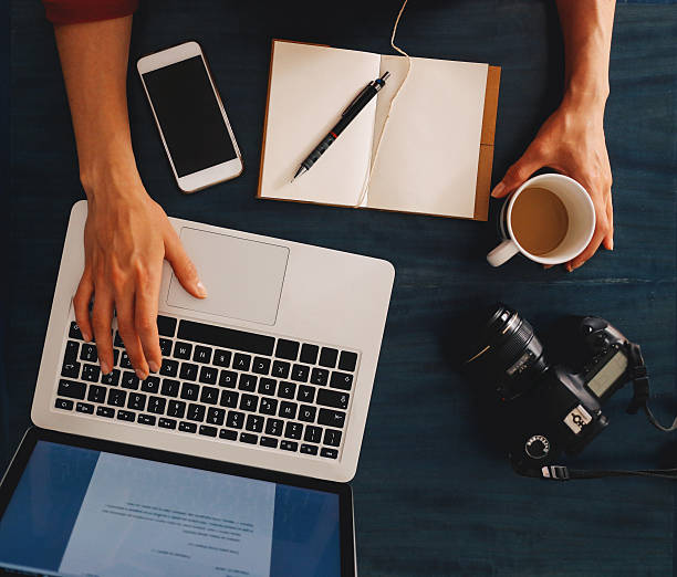 istock Overhead image of a workspace on the desk 517106198