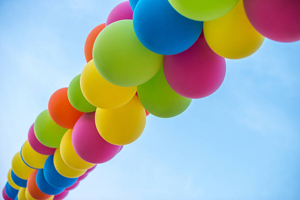 istock Colorful balloons on clear sky 517107482