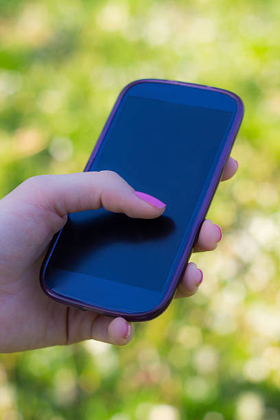 istock Woman holding smartphone 517107592