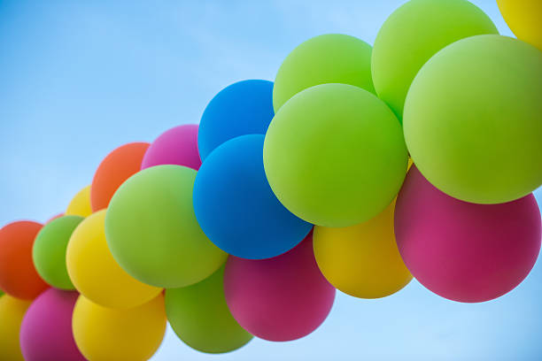 istock Colorful balloons on clear sky 517107742