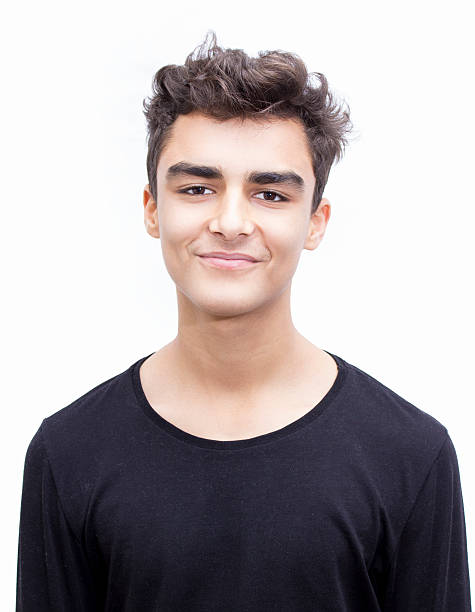 Portrait of smiling boy over white background