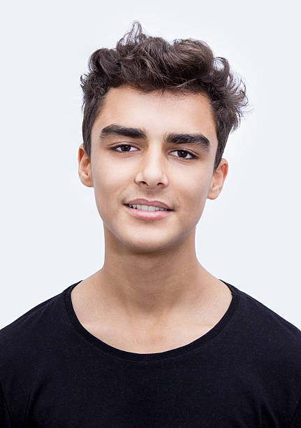 istock Portrait of smiling boy over white background 517109992