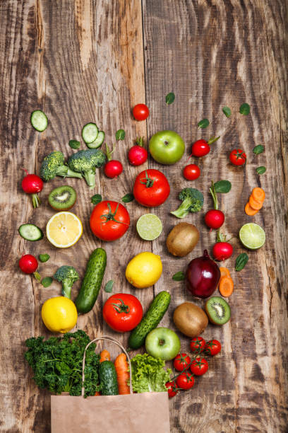 istock The vegetables from a paper bag on wooden table 517110784