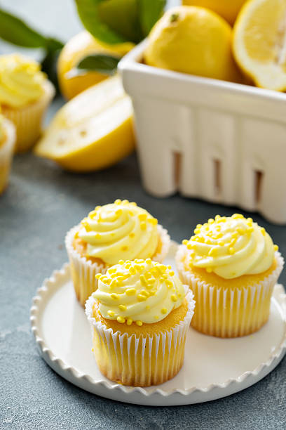 istock Lemon cupcakes with bright yellow frosting 517111882
