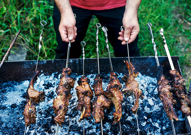 istock Man prepares shish kebab 517111940