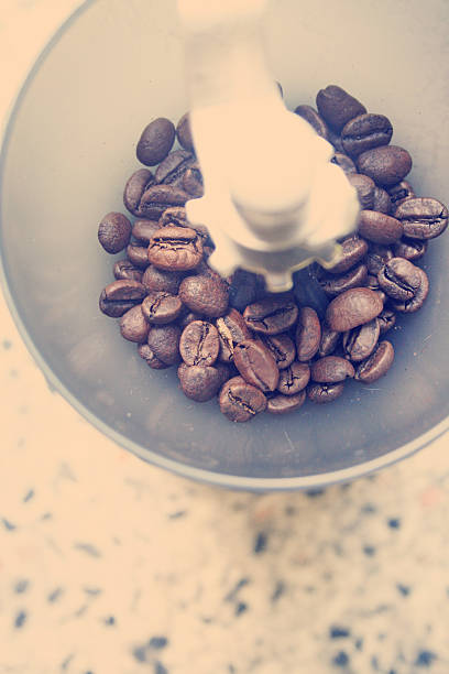 istock manual coffee grinder with coffee beans,retro filter effect 517116203