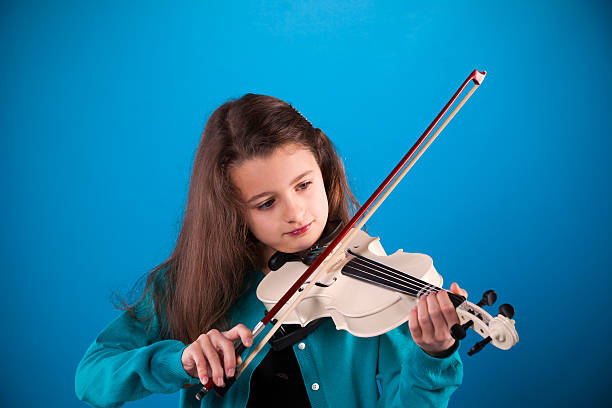 istock Female child playing the violin 517116625