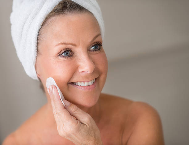 istock Woman removing makeup 517118309