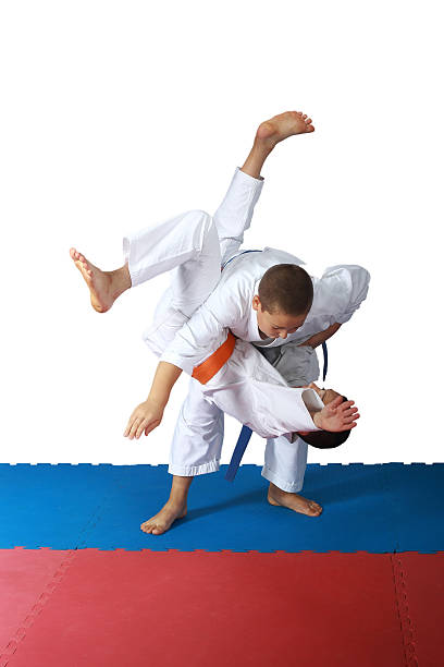 istock Techniques of throw  in the performance of athletes in judogi 517118617