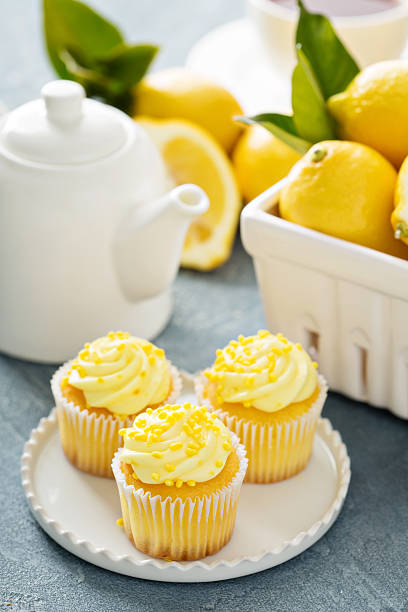 istock Lemon cupcakes with bright yellow frosting 517121712