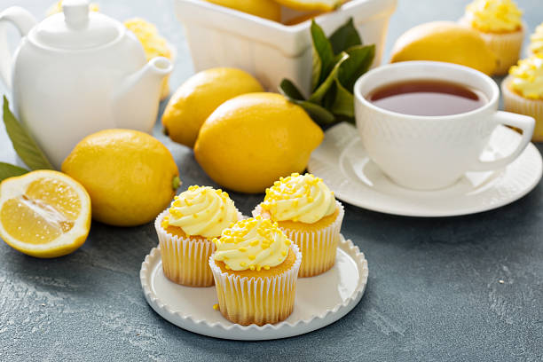 istock Lemon cupcakes with bright yellow frosting 517121964
