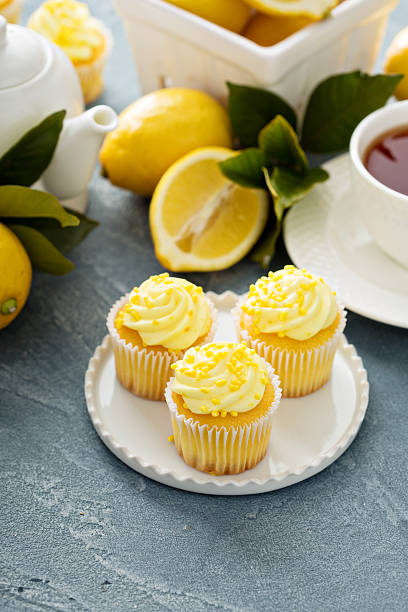 istock Lemon cupcakes with bright yellow frosting 517122170