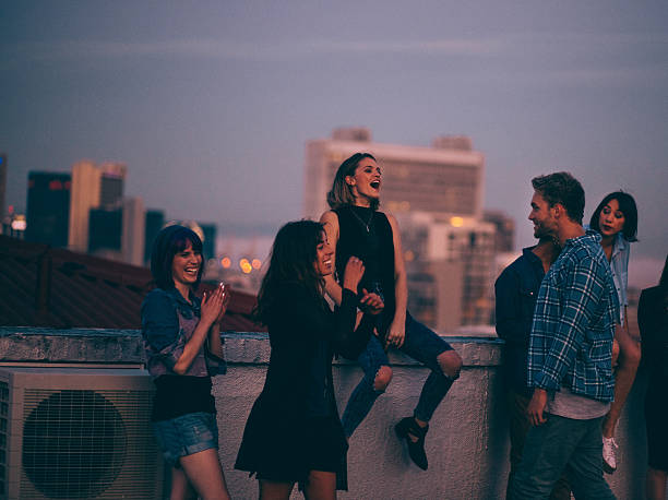 Teens celebrating a funny rooftop party