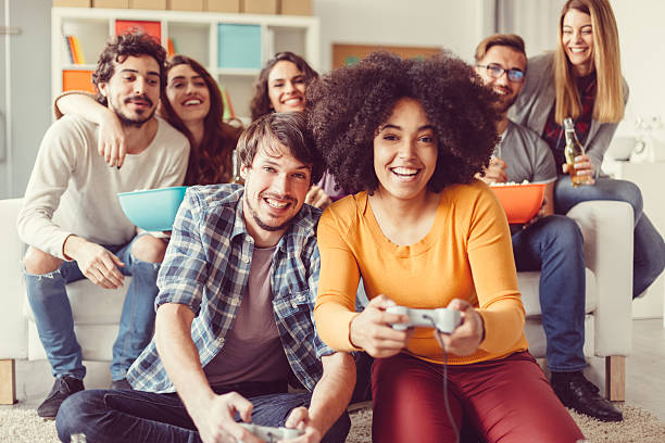 istock Colleagues playing video games in the office relax room 517125564