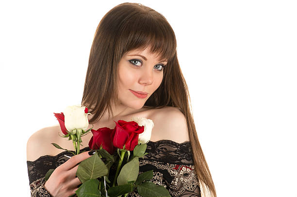 istock attractive girl with bouquet roses 517127248